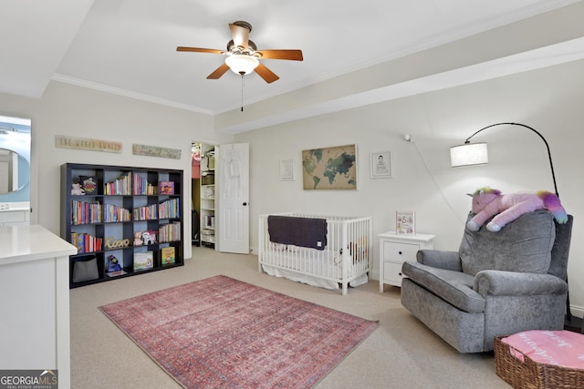 interior space with ceiling fan, ornamental molding, and light carpet