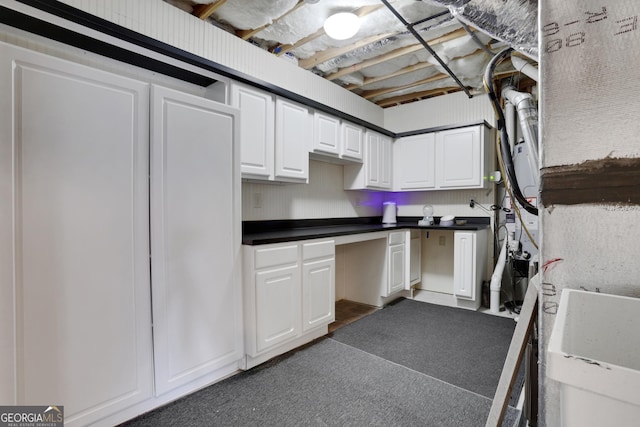 kitchen featuring white cabinetry