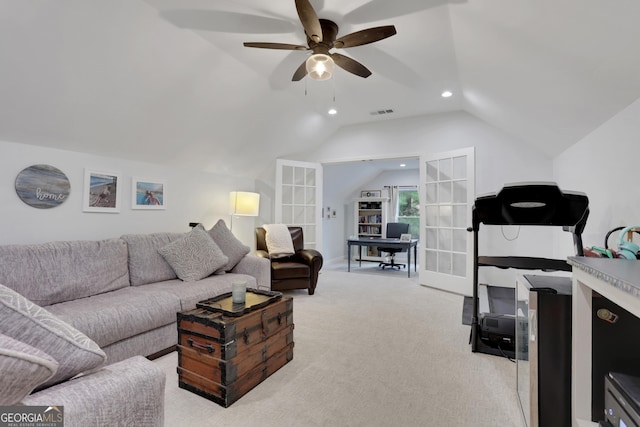 living room featuring light carpet, lofted ceiling, and ceiling fan