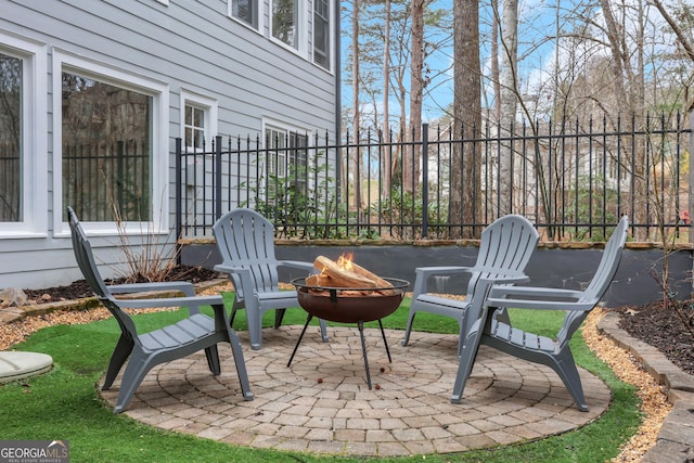 view of patio with an outdoor fire pit