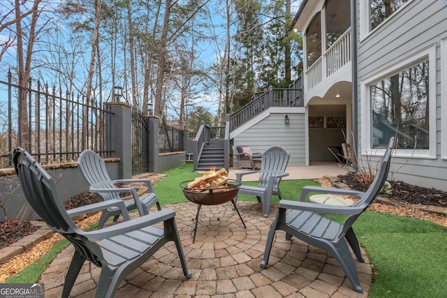 view of patio / terrace with an outdoor fire pit