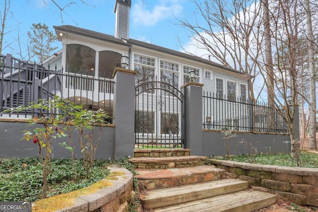 view of front of house with a sunroom