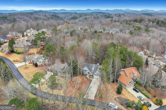 birds eye view of property with a mountain view