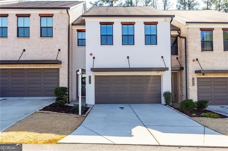 1012 Rohner Way, Smyrna, GA 30080 - view of property featuring a garage