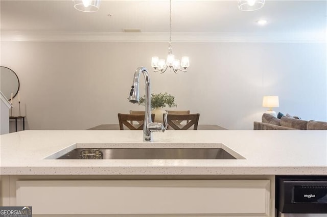 kitchen with sink, ornamental molding, dishwashing machine, and decorative light fixtures