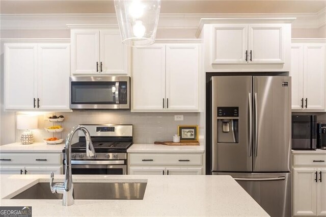 kitchen featuring white cabinetry, stainless steel appliances, and sink