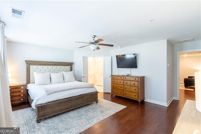 bedroom with ceiling fan and dark hardwood / wood-style floors