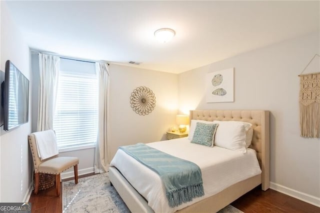 bedroom with wood-type flooring