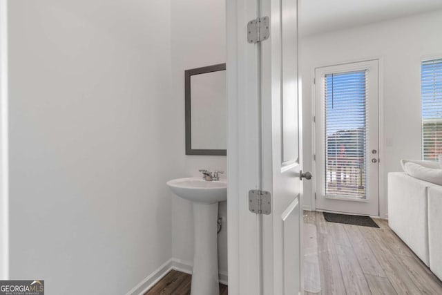 bathroom with sink and wood-type flooring