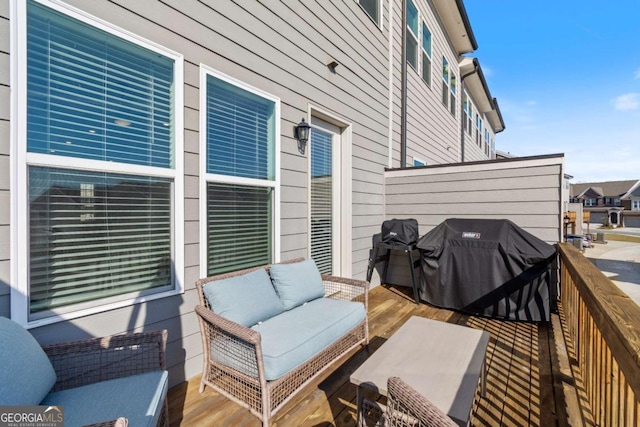 wooden terrace featuring outdoor lounge area and grilling area