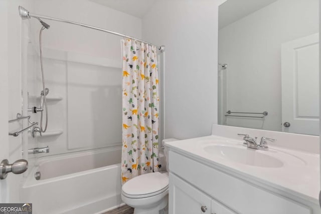 full bathroom with shower / tub combo with curtain, toilet, and vanity