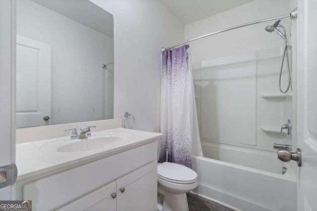 full bathroom with toilet, shower / bath combo with shower curtain, and vanity