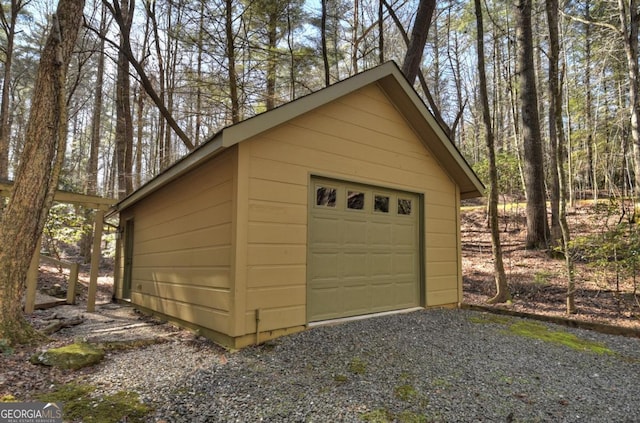 detached garage featuring driveway