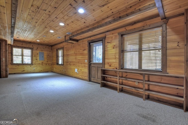 unfurnished room featuring carpet floors, recessed lighting, wood ceiling, and wood walls