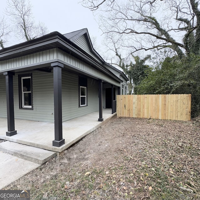 view of property exterior featuring a porch