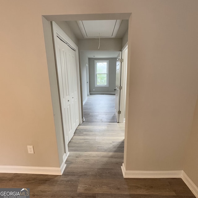 hall with wood-type flooring