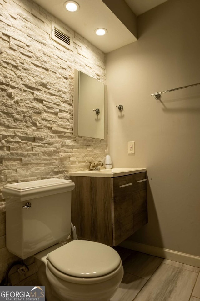 bathroom with vanity and toilet