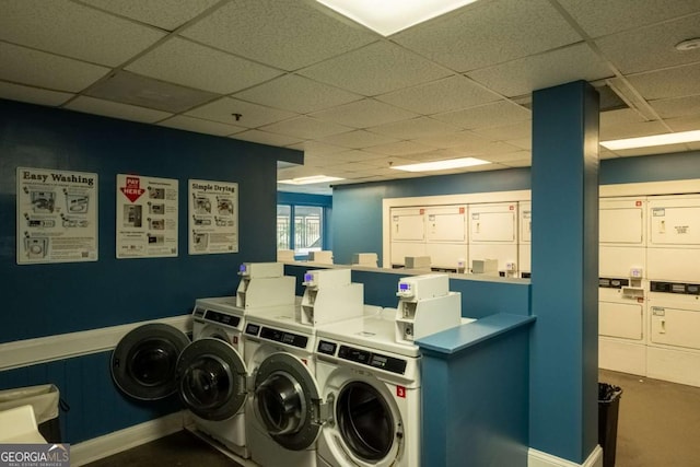 clothes washing area with stacked washer and dryer