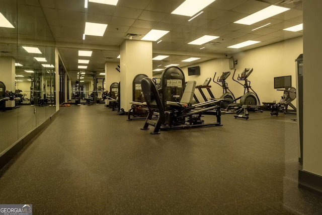 workout area with a paneled ceiling