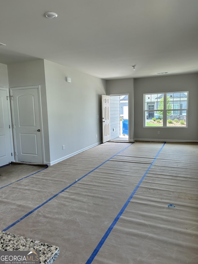 9 Wildflower Ln Unit 41, Dallas, GA 30132 - unfurnished living room with baseboards
