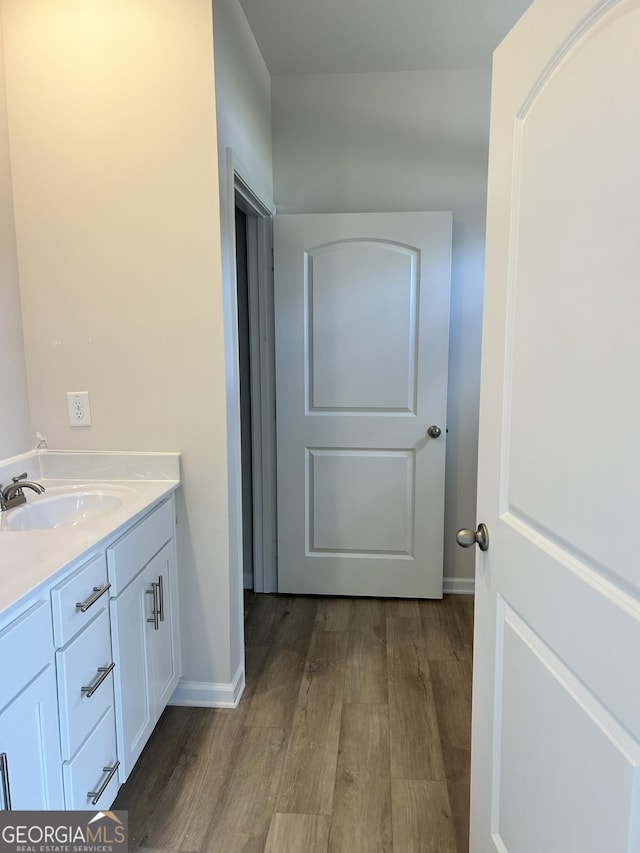 9 Wildflower Ln Unit 41, Dallas, GA 30132 - bathroom with wood finished floors, vanity, and baseboards