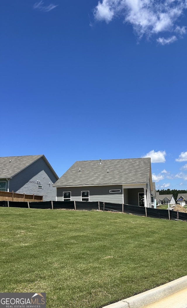 9 Wildflower Ln Unit 41, Dallas, GA 30132 - rear view of property featuring roof with shingles