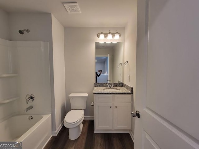 full bathroom with toilet, vanity, hardwood / wood-style floors, and shower / bathing tub combination