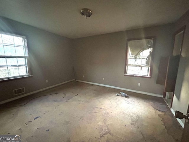 spare room featuring plenty of natural light