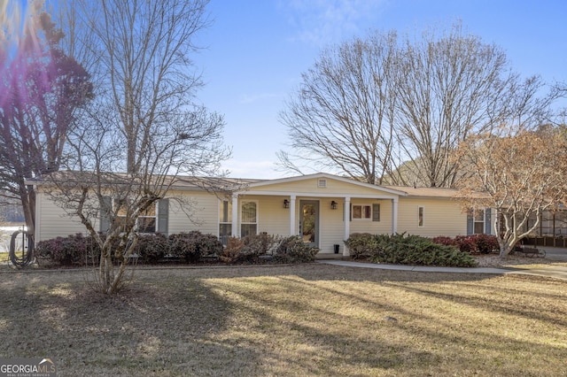 ranch-style home with a front lawn