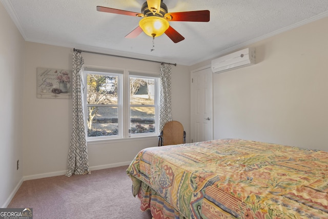 carpeted bedroom featuring a textured ceiling, crown molding, a wall mounted air conditioner, and ceiling fan