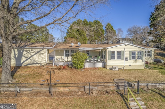 single story home with central AC unit, a front yard, and a porch