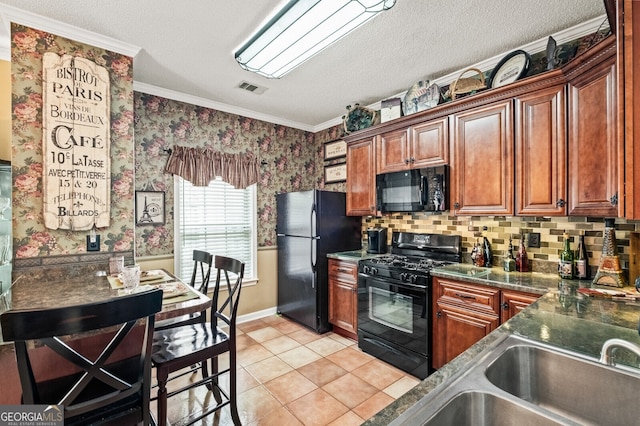 kitchen with black appliances, sink, light tile patterned floors, a textured ceiling, and crown molding