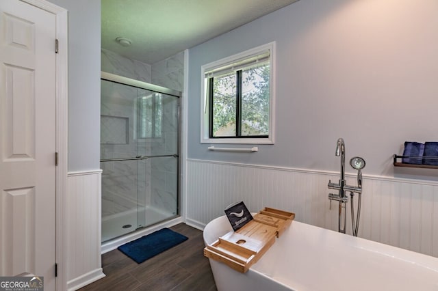 bathroom featuring a shower with door and wood-type flooring