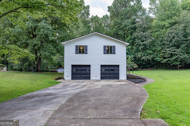 view of side of home with a lawn and a garage