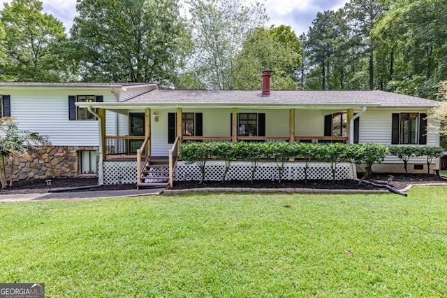 view of front facade featuring covered porch and a front yard