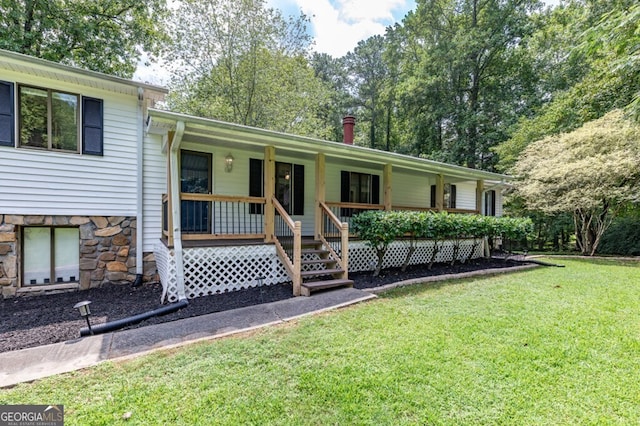 view of front facade with covered porch and a front lawn