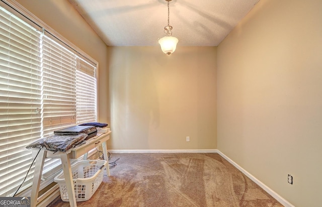 carpeted office with baseboards