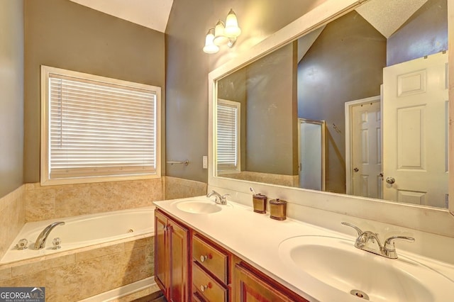 full bathroom featuring double vanity, a stall shower, a garden tub, and a sink