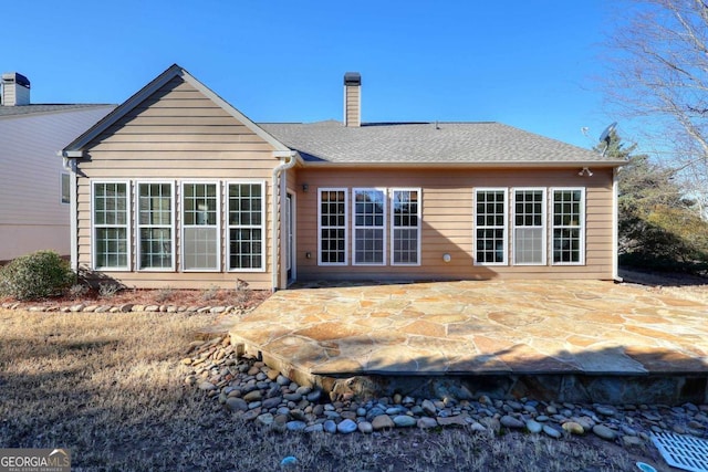 rear view of house featuring a patio area