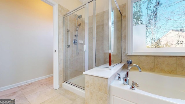 bathroom featuring tile patterned floors and independent shower and bath