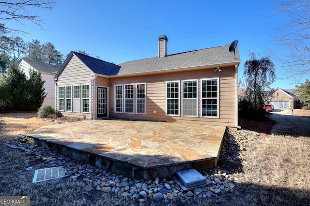 rear view of property with a patio