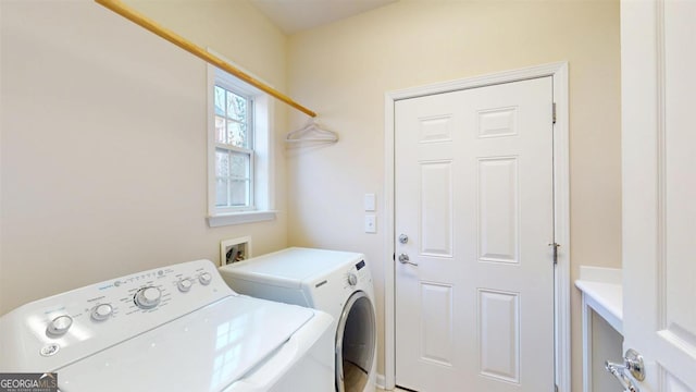 laundry room with washing machine and dryer