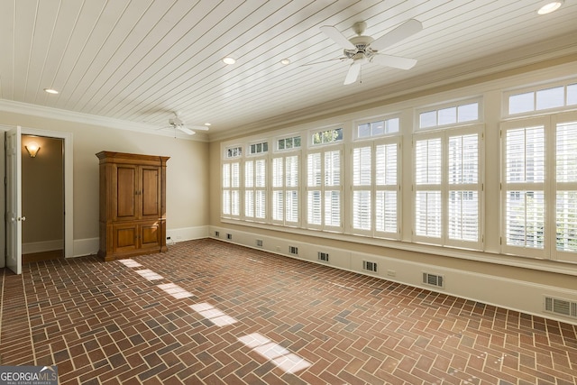 empty room with ornamental molding, ceiling fan, and wood ceiling