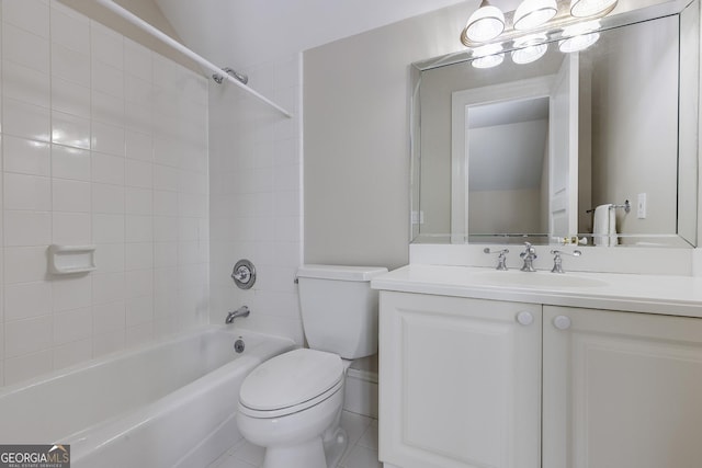 full bathroom with vanity, tiled shower / bath, and toilet