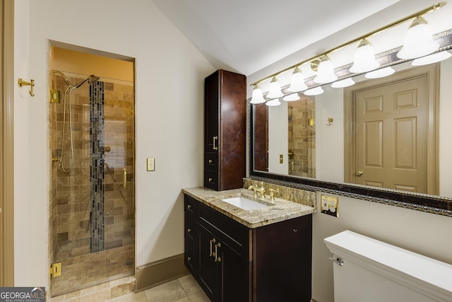 bathroom featuring vanity, vaulted ceiling, toilet, and walk in shower