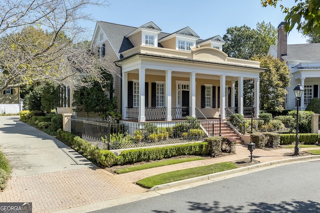 greek revival inspired property with covered porch