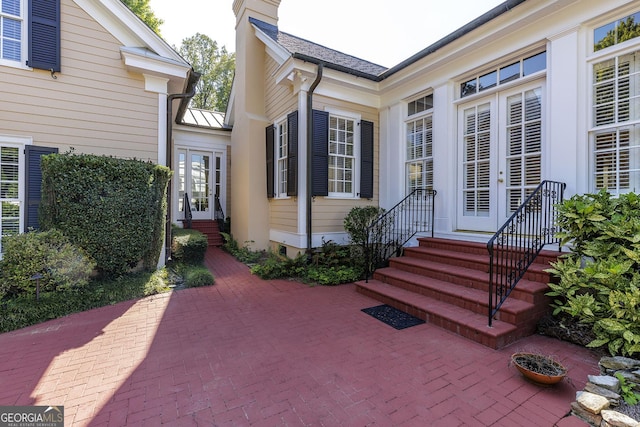 property entrance featuring a patio