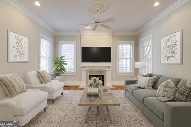 living room with light wood-type flooring, crown molding, and ceiling fan