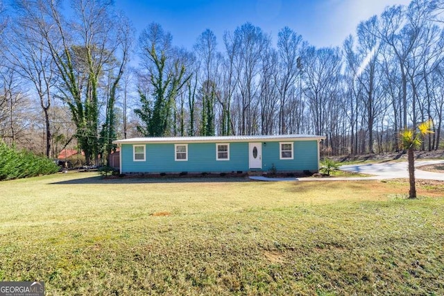 ranch-style house with a front lawn