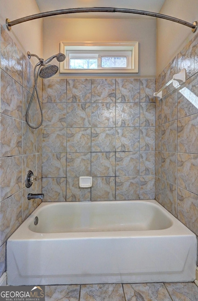 bathroom with bathing tub / shower combination